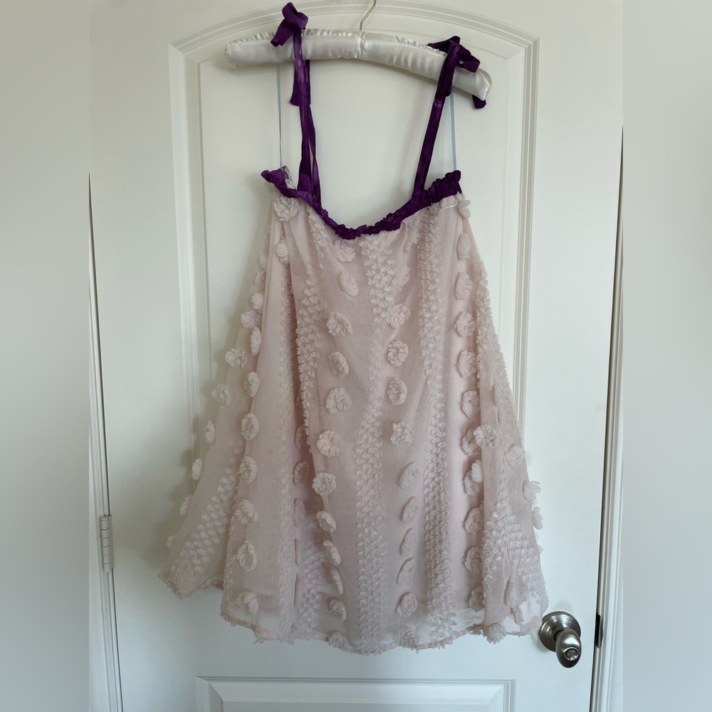 Pink lily beach style dress with flower type accents